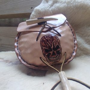 IHEA class sample of a tooled leather pouch