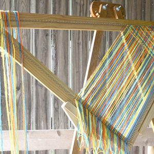 Cut strand weaving on a triangle loom