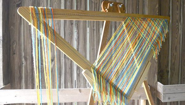 Cut strand weaving on a triangle loom