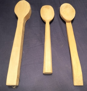 Wood spoons at various stages in the carving process